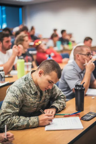 Military student in a classroom of students 